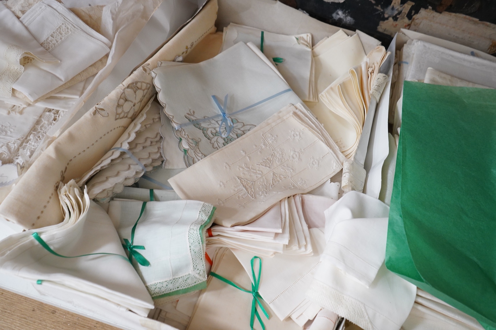 A collection of mixed damask embroidered and cutworked table cloths, napkin sets, hand towels and mats (in 3 boxes)